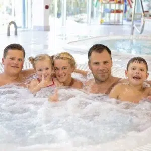 A family in the Värska aquatic centre hot tub.